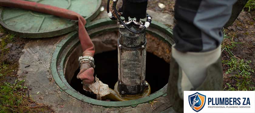 Plumber providing drain cleaning service in Gauteng clearing blocked drains and pipes